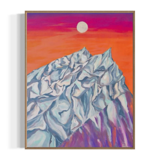 Framed artwork of a mountain landscape with a colorful sky.